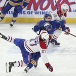 
              Buffalo Sabres right wing Tage Thompson (72) collides with Montreal Canadiens defenseman Alexander Romanov (27) during the third period of an NHL hockey game on Friday, Nov. 26, 2021, in Buffalo, N.Y. (AP Photo/Joshua Bessex)
            