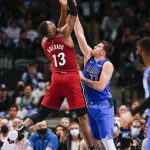 
              Miami Heat center Bam Adebayo (13) shoots as Dallas Mavericks guard Luka Doncic (77) defends during the first half of an NBA basketball game Tuesday, Nov. 2, 2021, in Dallas. (AP Photo/Brandon Wade)
            