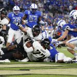 
              Army offensive lineman Jordyn Law (77) recovers a fumble for a touchdown against Air Force in overtime of an NCAA college football game in Arlington, Texas, Saturday, Nov. 6, 2021. Army beat Air Force 21-14.. (AP Photo/Tim Heitman)
            