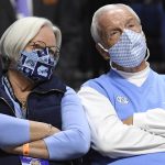 
              Former North Carolina head coach Roy Williams, right, and wife Wanda Williams watch the first half of an NCAA college basketball game between North Carolina and Purdue, Saturday, Nov. 20, 2021, in Uncasville, Conn. (AP Photo/Jessica Hill)
            