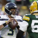 
              Seattle Seahawks' Russell Wilson looks to pass during the first half of an NFL football game against the Green Bay Packers Sunday, Nov. 14, 2021, in Green Bay, Wis. (AP Photo/Matt Ludtke)
            