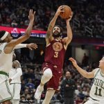 
              Cleveland Cavaliers' Ricky Rubio (3) drives to the basket against Boston Celtics' Romeo Langford (9) and Payton Pritchard (11) in the second half of an NBA basketball game, Saturday, Nov. 13, 2021, in Cleveland. The Cavaliers won 91-89. (AP Photo/Tony Dejak)
            