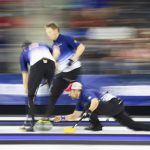 
              Team Dropkin's Joe Polo, right, throws the rock as Mark Fenner, left, and Tom Howell sweep while competing against Team Shuster during the second night of finals at the U.S. Olympic Curling Team Trials at Baxter Arena in Omaha, Neb., Saturday, Nov. 20, 2021. (AP Photo/Rebecca S. Gratz)
            