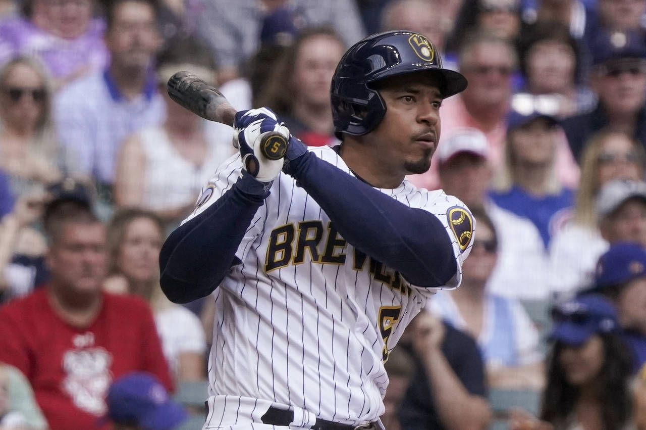 FILE - Milwaukee Brewers' Eduardo Escobar watches his RBI double during the fifth inning of the tea...