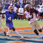 
              Florida State defensive back Jarvis Brownlee Jr. (3) runs past Florida wide receiver Justin Shorter (4) after intercepting a pass in the end zone during the first half of an NCAA college football game, Saturday, Nov. 27, 2021, in Gainesville, Fla. (AP Photo/John Raoux)
            