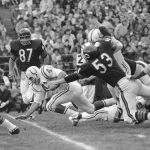 
              FILE - Baltimore Colts back Tom Matte (41) trips over a teammate after a two-yard gain in the first quarter against the Chicago Bears on Oct. 8, 1967, in Chicago. He was downed by Chicago Bears end Ed O'Bradovich (87). Baltimore won 24-3. Matte, who spent his entire 12-year NFL career as a gritty running back for the Baltimore Colts _ except for a star turn for three games in 1965 as their quarterback _ has died. He was 82. The Baltimore Ravens confirmed Matte's death during coach John Harbaugh's news conference Wednesday, Nov. 3, 2021. No details were provided.(AP Photo/Charles Harrity/File)
            