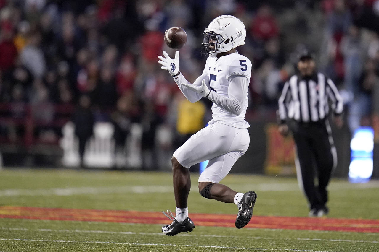 Penn State wide receiver Jahan Dotson catches a pass from quarterback Sean Clifford, not visible, b...