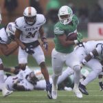
              North Texas running back Ikaika Ragsdale rushes the ball during the first half of an NCAA college football game against UTSA in Denton, Texas, Saturday, Nov. 27, 2021. (AP Photo/Andy Jacobsohn)
            