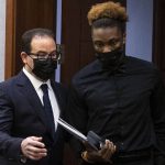 
              Henry Ruggs, right, former Raiders wide receiver, accused of DUI resulting in death, enters the courtroom with his attorney Richard Schonfeld, at the Regional Justice Center, Monday, Nov. 22, 2021, in Las Vegas. (Bizuayehu Tesfaye/Las Vegas Review-Journal via AP, Pool)
            