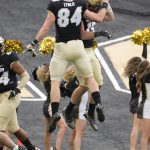 Colorado tight end Matt Lynch, left, congratulates linebacker Jack Lamb after Lamb recovered a fumble and ran for a touchdown in the first half of an NCAA college football game against Washington, Saturday, Nov. 20, 2021, in Boulder, Colo. (AP Photo/David Zalubowski)