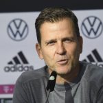 
              DFB director Oliver Bierhoff talks to the media at a press conference wearing mouth-nose protection in Wolfsburg, Germany, prior the World Cup qualifying match against Liechtenstein, Tuesday, Nov. 9, 2021. There is said to be a positive Corona case in the national football team circle. National coach Hansi Flick cancelled the planned training in the morning at the stadium in Wolfsburg. Five players have to be quarantined in Wolfsburg. (Swen Pfoertner/dpa via AP)
            