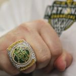 
              A Baylor staff member displays his 2021 NCAA basketball national championship ring before an NCAA college basketball game against Incarnate Word, Friday, Nov. 12, 2021, in Waco, Texas. (Jerry Larson/Waco Tribune-Herald via AP)
            