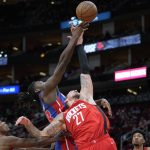 
              Houston Rockets center Daniel Theis (27) and Detroit Pistons center Isaiah Stewart reach for a rebound during the first half of an NBA basketball game Wednesday, Nov. 10, 2021, in Houston. (AP Photo/Eric Christian Smith)
            