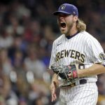 
              Milwaukee Brewers' Corbin Burnes reacts after striking out a batter during the seventh inning of a baseball game against the New York Mets on Sept. 25, 2021, in Milwaukee. Burnes won the NL Cy Young Award on Wednesday, Nov. 17, 2021. (AP Photo/Aaron Gash, File)
            