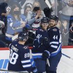 
              Winnipeg Jets' Nate Schmidt (88), Josh Morrissey (44) and Kyle Connor (81) celebrate Connor's goal against the Chicago Blackhawks during the second period of an NHL hockey game Friday, Nov. 5, 2021, in Winnipeg, Manitoba. (John Woods/The Canadian Press via AP)
            