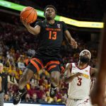 
              Oregon State guard Dashawn Davis (13) drives to the basket ahead of Iowa State guard Tre Jackson (3) during the second half of an NCAA college basketball game, Friday, Nov. 12, 2021, in Ames, Iowa. (AP Photo/Charlie Neibergall)
            