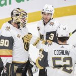 
              Vegas Golden Knights goaltender Robin Lehner (90) is congratulated by teammates Brayden McNabb (3) and Dylan Coghlan (52) after defeating the Montreal Canadiens in an NHL hockey game in Montreal, Saturday, Nov. 6, 2021. (Graham Hughes/The Canadian Press via AP)
            