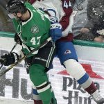 
              Colorado Avalanche left wing Kiefer Sherwood (44) is checked into the boards by Dallas Stars right wing Alexander Radulov (47) during the first period of an NHL hockey game in Dallas, Friday, Nov. 26, 2021. (AP Photo/LM Otero)
            