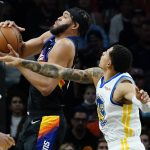
              Phoenix Suns center JaVale McGee shoots as Golden State Warriors forward Juan Toscano-Anderson, right, defends during the first half of an NBA basketball game, Tuesday, Nov. 30, 2021, in Phoenix. (AP Photo/Matt York)
            