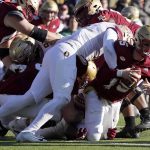 
              Boston College quarterback Phil Jurkovec (5) is sacked by Florida State defensive end Jermaine Johnson II (11) during the first half of an NCAA college football game, Saturday, Nov. 20, 2021, in Boston. (AP Photo/Mary Schwalm)
            