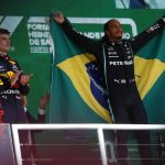 
              Mercedes driver Lewis Hamilton, of Britain, right, celebrates his victory over Red Bull driver Max Verstappen, of The Netherlands, right, in the Brazilian Formula One Grand Prix at the Interlagos race track in Sao Paulo, Brazil, Sunday, Nov. 14, 2021. Max Verstappen finished second. (AP Photo/Marcelo Chello)
            