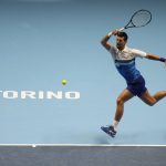 
              Serbia's Novak Djokovic returns the ball to Norways' Casper Ruud during their ATP World Tour Finals singles tennis match, at the Pala Alpitour in Turin, Monday, Nov. 15, 2021. (AP Photo/Luca Bruno)
            