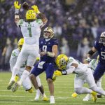 
              Washington quarterback Dylan Morris (9) has a pass tipped by Oregon linebacker Noah Sewell (1) during the first half of an NCAA college football game, Saturday, Nov. 6, 2021, in Seattle. (AP Photo/Stephen Brashear)
            