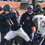 
              Chicago Bears wide receiver Darnell Mooney (11) catches a deep pass from quarterback Justin Fields as Baltimore Ravens safety Chuck Clark defends during the first half of an NFL football game Sunday, Nov. 21, 2021, in Chicago. (AP Photo/Nam Y. Huh)
            