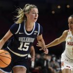 
              Villanova's Brooke Mullin drives to the basket as Maryland's Katie Benzan defends during the second half of an NCAA college basketball game on Friday, Nov. 12, 2021, in College Park, Md. Maryland won 88-67. (AP Photo/Gail Burton)
            