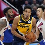 
              Indiana Pacers guard Malcolm Brogdon (7) drives as Detroit Pistons forward Saddiq Bey, left, and guard Cade Cunningham (2) defend during the second half of an NBA basketball game, Wednesday, Nov. 17, 2021, in Detroit. (AP Photo/Carlos Osorio)
            