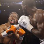 
              Terence Crawford hits Shawn Porter during a welterweight title boxing match Saturday, Nov. 20, 2021, in Las Vegas. (AP Photo/Chase Stevens)
            