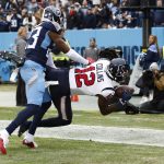 
              Houston Texans wide receiver Nico Collins (12) is brought down by Tennessee Titans cornerback Chris Jones (23) in the end zone by in the first half of an NFL football game Sunday, Nov. 21, 2021, in Nashville, Tenn. The pass was ruled incomplete. (AP Photo/Wade Payne)
            
