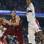 
              Cleveland Cavaliers' Cedi Osman (16) passes against Washington Wizards' Daniel Gafford (21) in the first half of an NBA basketball game, Wednesday, Nov. 10, 2021, in Cleveland. (AP Photo/Tony Dejak)
            