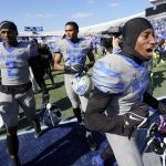 
              Memphis defensive back Sylvonta Oliver, right, celebrates as players leave the field after Memphis upset SMU in an NCAA college football game Saturday, Nov. 6, 2021, in Memphis, Tenn. (AP Photo/Mark Humphrey)
            