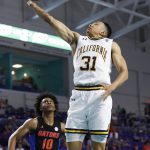 
              California guard Jordan Shepherd (31) drives to the basket past Florida guard Elijah Kennedy (10) during the second half of an NCAA college basketball game on Monday, Nov. 22, 2021, in Fort Myers, Fla. (AP Photo/Scott Audette)
            