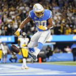 
              Los Angeles Chargers running back Austin Ekeler celebrates after scoring a touchdown during the second half of an NFL football game against the Pittsburgh Steelers, Sunday, Nov. 21, 2021, in Inglewood, Calif. (AP Photo/Ashley Landis)
            