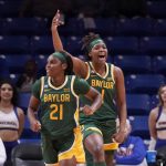 
              Baylor 's Ja'Mee Asberry (21) and NaLyssa Smith (1) celebrate after Asberry sunk a three-point basket in the first half of an NCAA college basketball game in Arlington, Texas, Thursday, Nov. 11, 2021. (AP Photo/Tony Gutierrez)
            