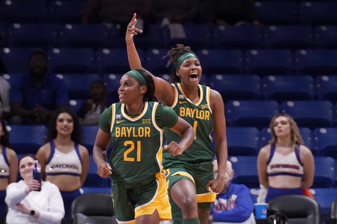 Baylor 's Ja'Mee Asberry (21) and NaLyssa Smith (1) celebrate after Asberry sunk a three-point bask...