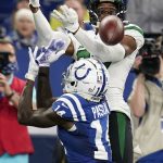 
              New York Jets' Bryce Hall (37) breaks up a pass intended for Indianapolis Colts' Zach Pascal (14) during the first half of an NFL football game, Thursday, Nov. 4, 2021, in Indianapolis. (AP Photo/Michael Conroy)
            