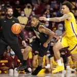 
              Purdue Fort Wayne guard Jalon Pipkins (50) drives against Minnesota guard Sean Sutherlin (24) and forward Charlie Daniels (15) in the first half of an NCAA college basketball game, Friday, Nov. 19, 2021, in Minneapolis. (AP Photo/Andy Clayton-King)
            
