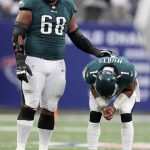 
              Philadelphia Eagles offensive tackle Jordan Mailata, left, stands with quarterback Jalen Hurts after a pass intended for wide receiver Jalen Reagor was broken up in the fourth quarter of an NFL football game against the New York Giants, Sunday, Nov. 28, 2021, in East Rutherford, N.J. (Monica Herndon/The Philadelphia Inquirer via AP)
            