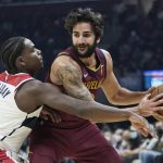 
              Washington Wizards' Aaron Holiday (4) tries to knock the ball loose from Cleveland Cavaliers' Ricky Rubio (3) in the first half of an NBA basketball game, Wednesday, Nov. 10, 2021, in Cleveland. (AP Photo/Tony Dejak)
            