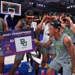 
              In this photo provided by Bahamas Visual Services, Baylor guard James Akinjo (11) celebrates with teammates after defeating Michigan State in an NCAA college basketball game at Paradise Island, Bahamas, Friday, Nov. 26, 2021. (Tim Aylen/Bahamas Visual Services via AP)
            