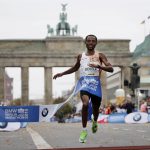 
              FILE - Ethiopia's Kenenisa Bekele crosses the finish line to win the 46th Berlin marathon in Berlin, Germany, Sunday, Sept. 29, 2019. The 50th edition of the New York City Marathon will be run Sunday, Nov. 7, 2021. Bekele is the headliner for the men's race. (AP Photo/Michael Sohn, File)
            