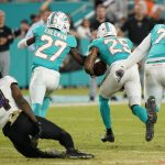 
              Miami Dolphins cornerback Xavien Howard (25) runs with the ball for a touchdown after recovering a fumble by Baltimore Ravens wide receiver Sammy Watkins (14) during the second half of an NFL football game, Thursday, Nov. 11, 2021, in Miami Gardens, Fla. (AP Photo/Wilfredo Lee)
            