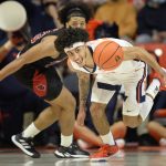 
              Illinois' Andre Curbelo eyes a loose ball during the first half of an NCAA college basketball game against Arkansas State Friday, Nov. 12, 2021, in Champaign, Ill. (AP Photo/Michael Allio)
            