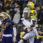 
              Oregon wide receiver Mycah Pittman, left, and wide receiver Devon Williams, right, celebrate a touchdown reception by Williams during the first half of a NCAA college football game against Washington, Saturday, Nov. 6, 2021, in Seattle. (AP Photo/Stephen Brashear)
            