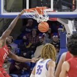 
              Rutgers' Cliff Omoruyi (11) dunks against DePaul during the second half of an NCAA college basketball game Thursday, Nov. 18, 2021, in Chicago. (AP Photo/Mark Black)
            
