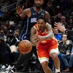 
              Atlanta Hawks guard Lou Williams (6) cannot hang onto the ball as he tries to get past Orlando Magic guard Terrence Ross, top, in the second half of an NBA basketball game Monday, Nov. 15, 2021, in Atlanta. (AP Photo/John Bazemore)
            