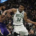 
              Milwaukee Bucks' Giannis Antetokounmpo tries to get past Los Angeles Lakers' Anthony Davis during the second half of an NBA basketball game Wednesday, Nov. 17, 2021, in Milwaukee. The Bucks won 109-102. (AP Photo/Morry Gash)
            